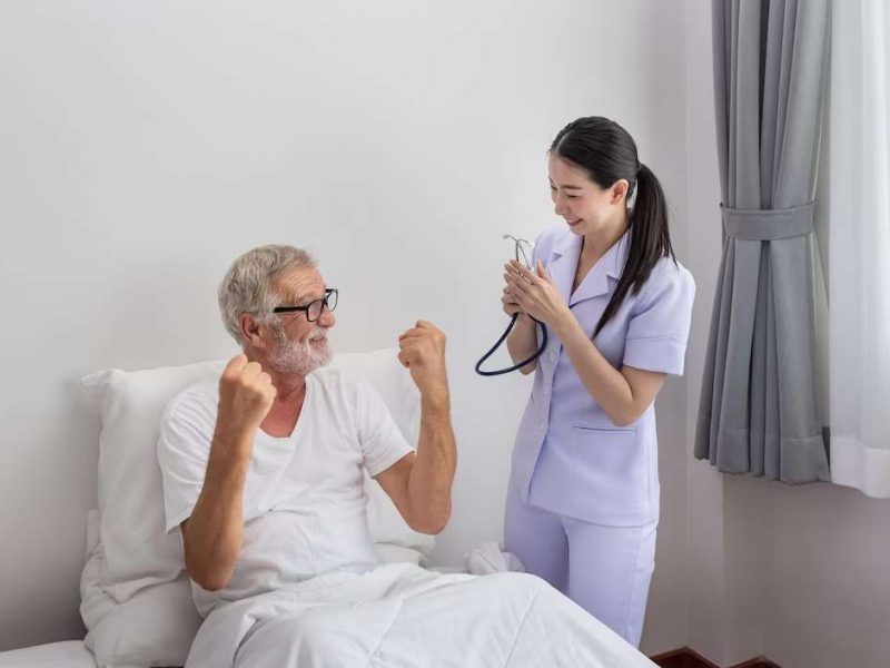 elderly-man-healthy-rise-fist-up-with-happy-nurse-bedroom-nursing-home-thumb-up_554837-217