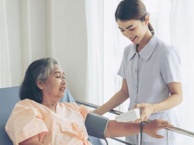 nurse-measuring-blood-pressure-senior-elderly-woman-hospital-bed-patients-medical-healthcare-senior-